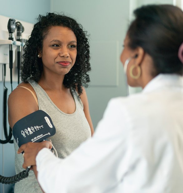 a woman visits her primary care doctor at Equitas Health.